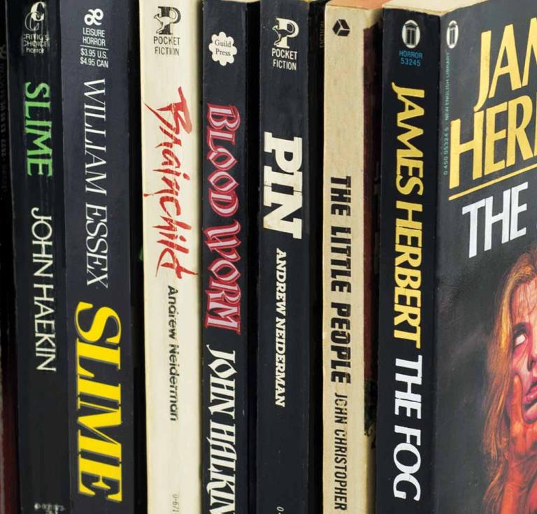 A selection of horror fiction paperbacks from the author’s collection.