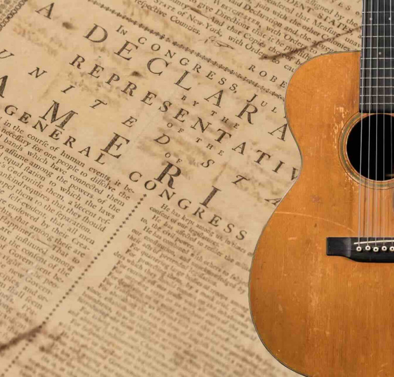 One of The Huntington’s annotated July 1776 printings of the Declaration of Independence and a 1936 acoustic guitar owned by Woody Guthrie